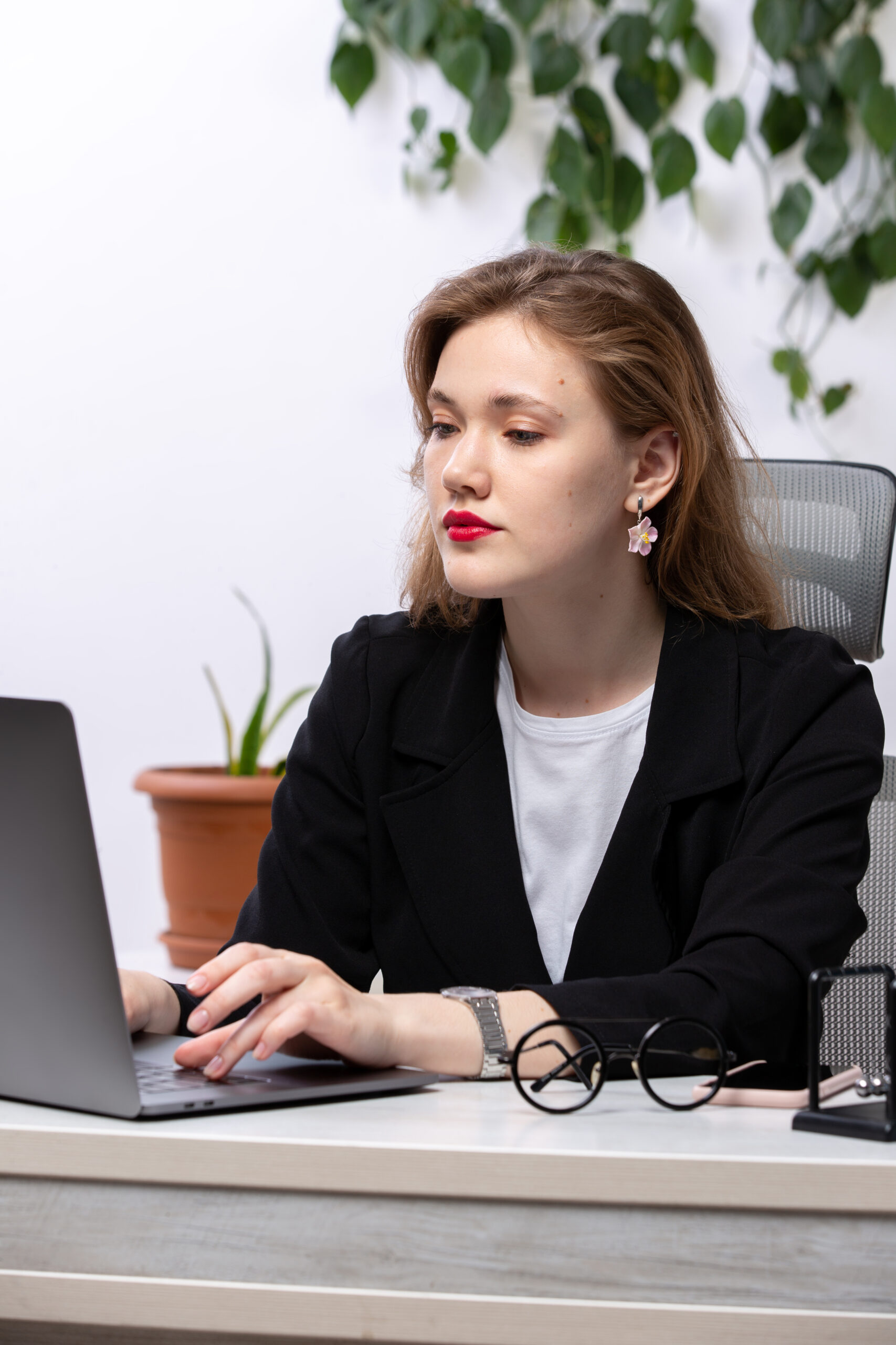 Front view young attractive lady black jacket white shirt front table working with laptop work business technologies scaled